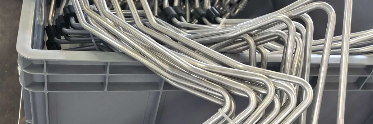 Bent aluminium AC tube assemblies with protective caps